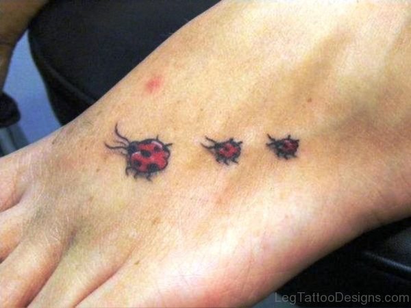 3 Little Ladybug Tattoos On Foot