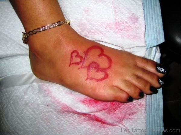 3 Pink Hearts Tattoo On Foot