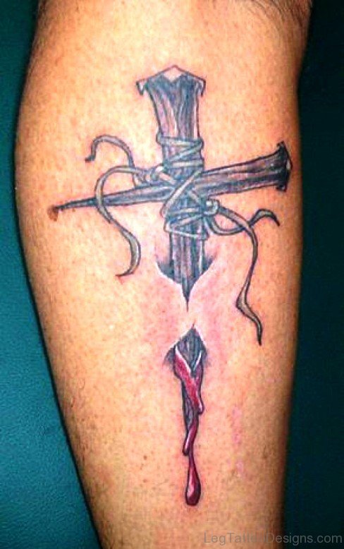 Adorable Cross Tattoo On Leg