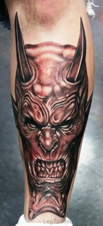 Angry Faced Evil Tattoo On Leg