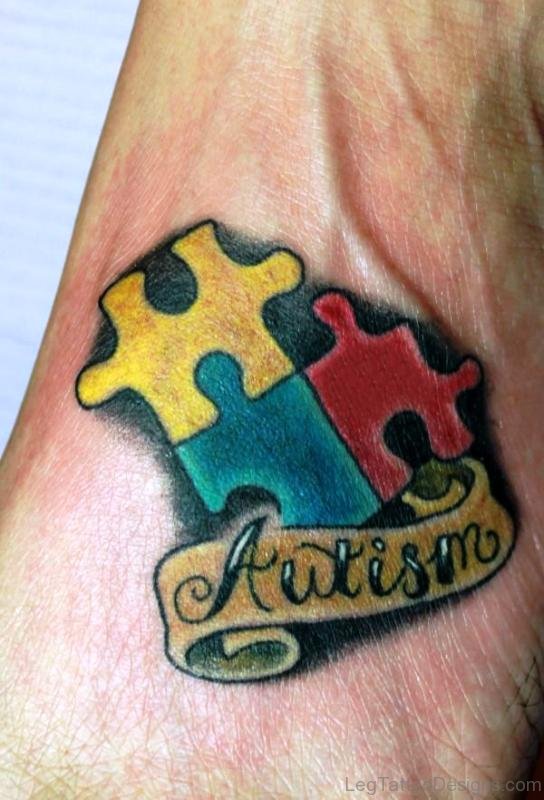 Autism Banner Puzzle Tattoo On Foot