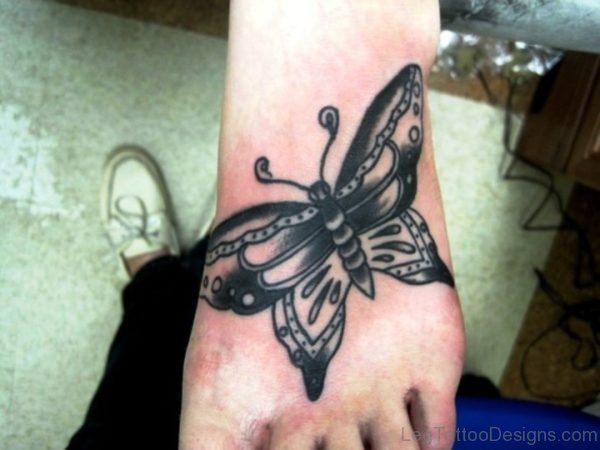 Big Tribal Butterfly Tattoo On Foot