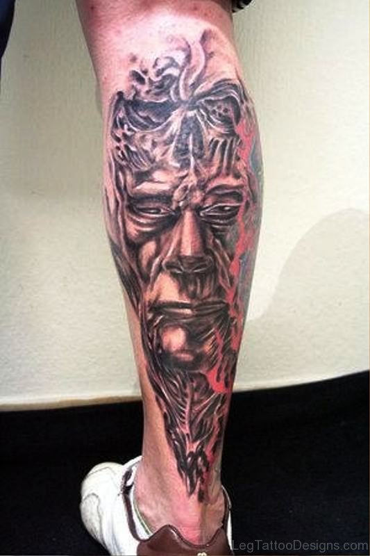 Biomechanical Evil Face Tattoo On Leg