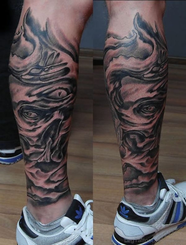 Biomechanical Face Tattoo On Leg