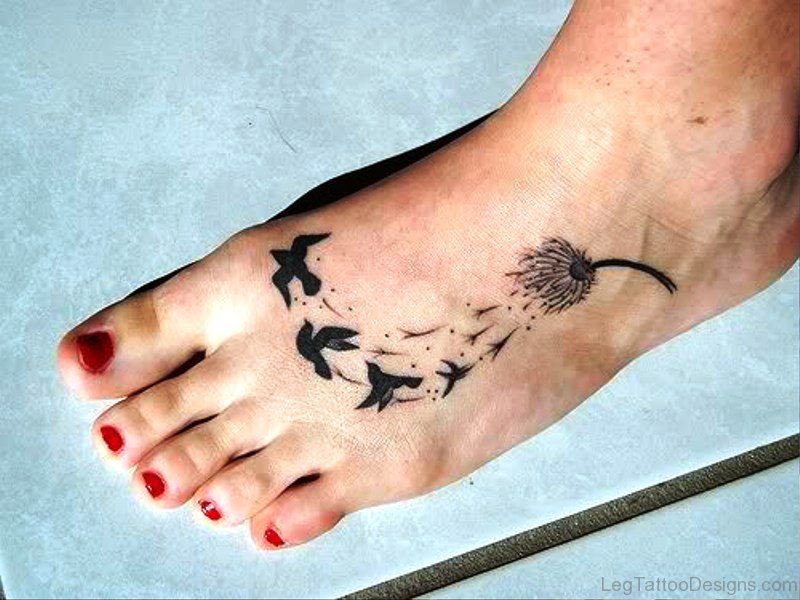 Birds Flying From Dandelion On Foot