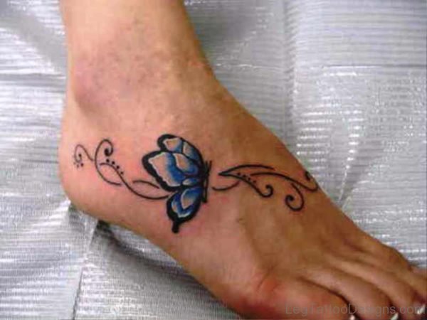 Black And Blue Butterfly Tattoo On Foot