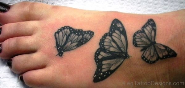 Black And Grey Butterfly Tattoo On Foot