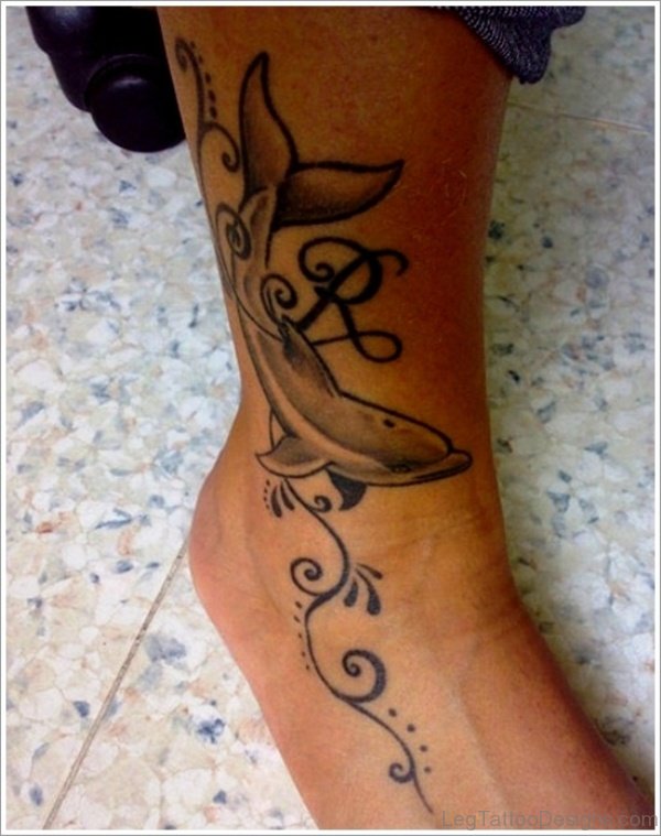 Black And Grey Dolphin Tattoo On Foot