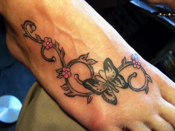 Black Butterfly With Pink Flowers Tattoo
