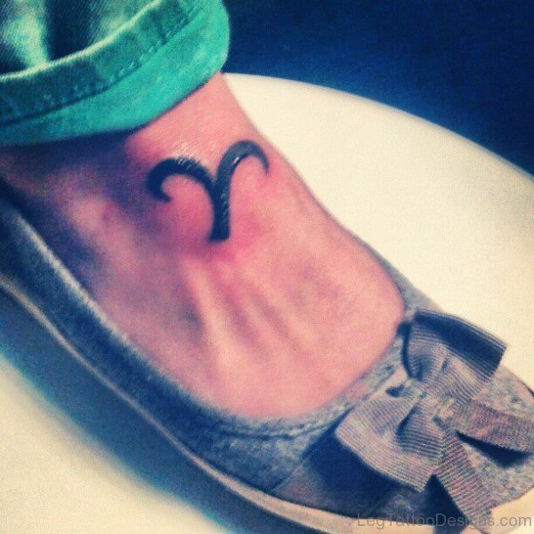 Black Ink Aries Tattoo On Foot