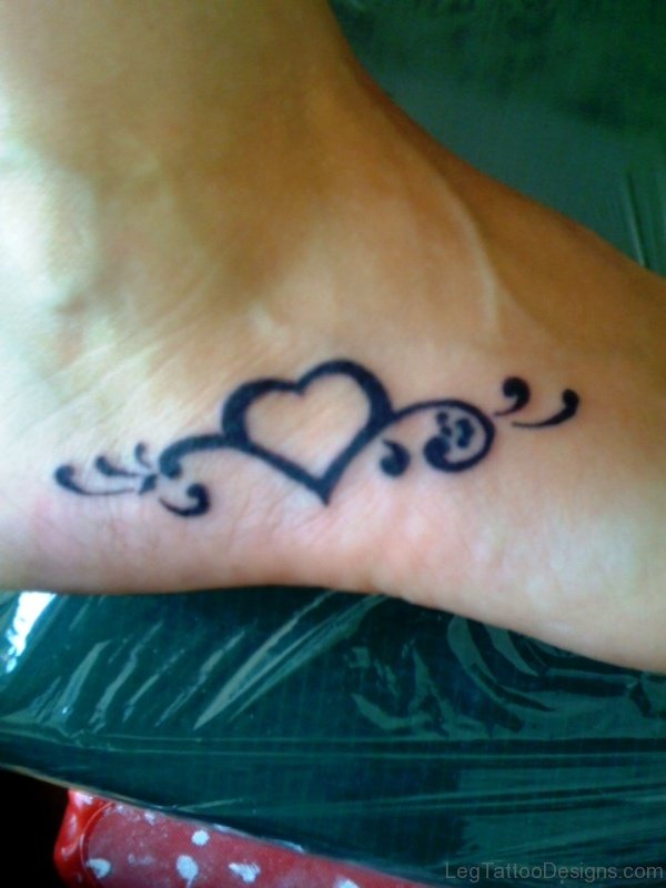 Black Inked Heart Tattoo On Foot