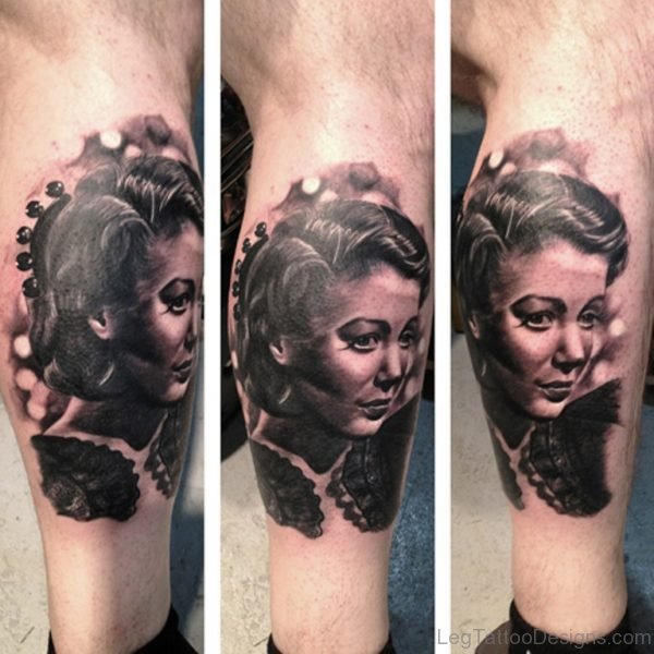 Black Portrait Tattoo On Leg 