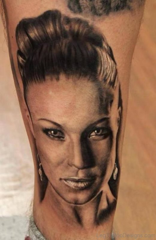 Black Portrait Tattoo On Leg