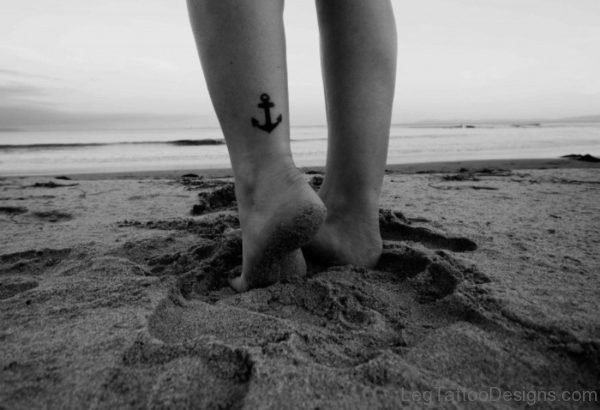 Black Small Anchor Tattoo On Leg