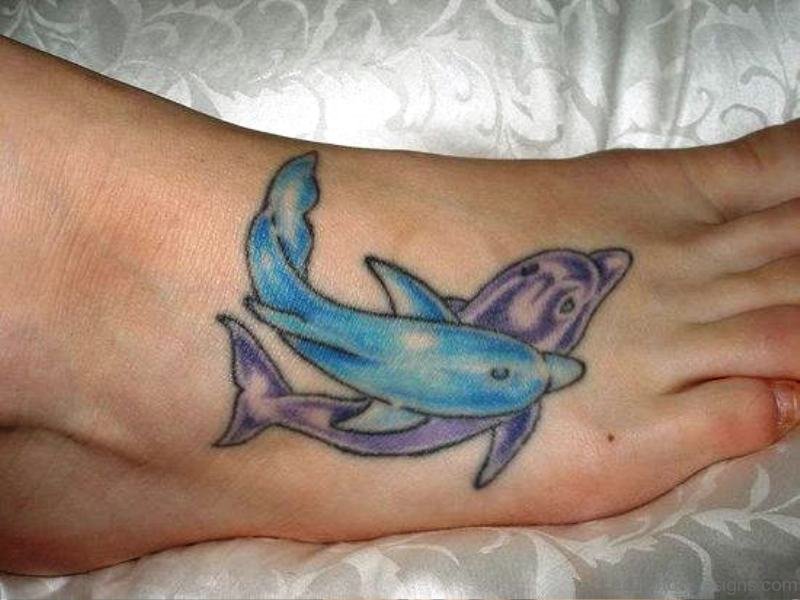 Blue And Purple Dolphin Tattoo On Foot