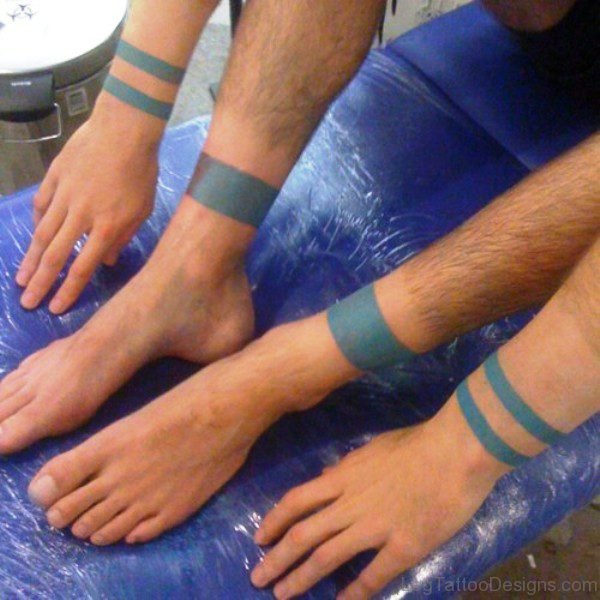 Blue Band Tattoo On Legs And Arms