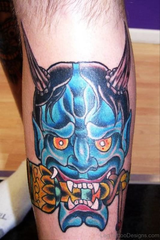 Blue Faced Evil Tattoo On Leg