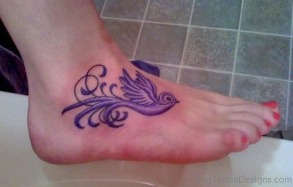 Blue Ink Bird Tattoo On Foot