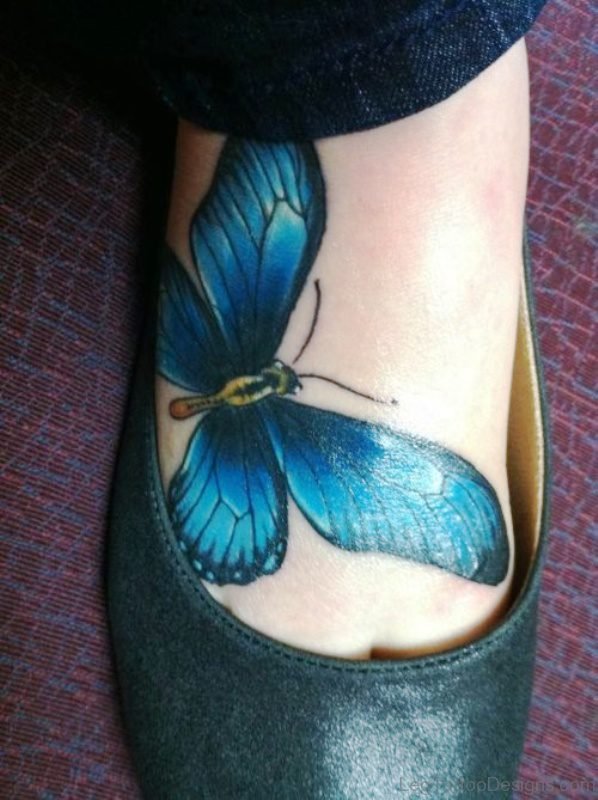 Blue Ink Butterfly Tattoo On Foot