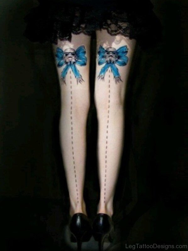 Blue Skull Bow Tattoo On Thigh