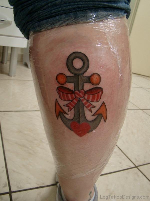 Bow And Anchor Tattoo On Leg