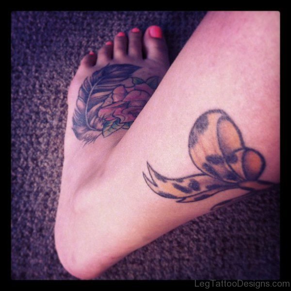 Brown Print Bow Tattoo On Leg