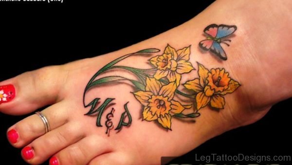 Butterfly With Daffodil Tattoo On Foot