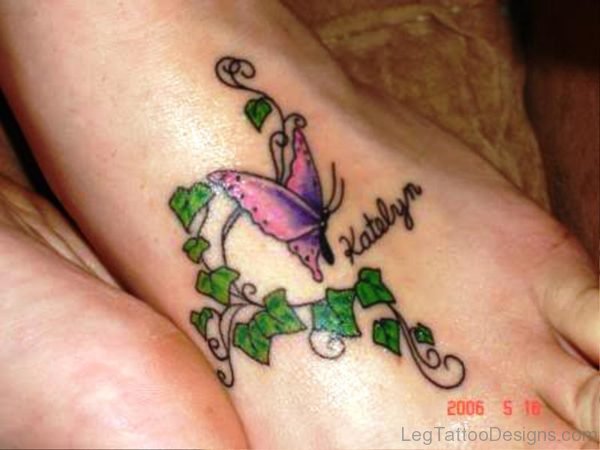 Butterfly With Green Leaves Tattoo