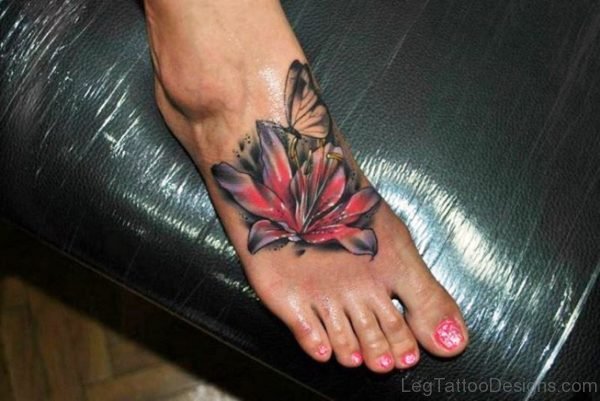 Butterfly With Lily Flower Tattoo On Foot