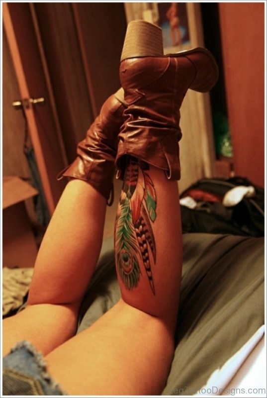 Colored Feather Tattoo On Leg