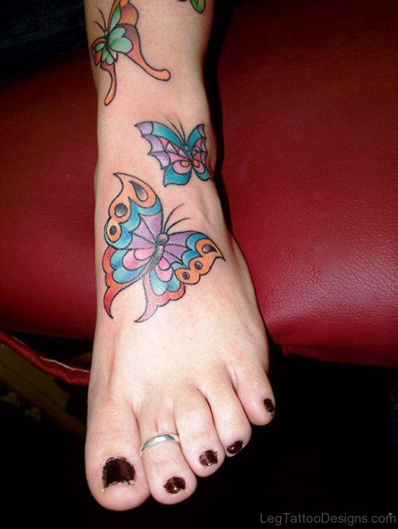 Colorful Butterflies Tattoo On Foot