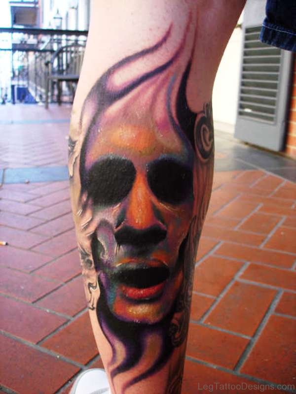 Colorful Evil Face Tattoo On Leg