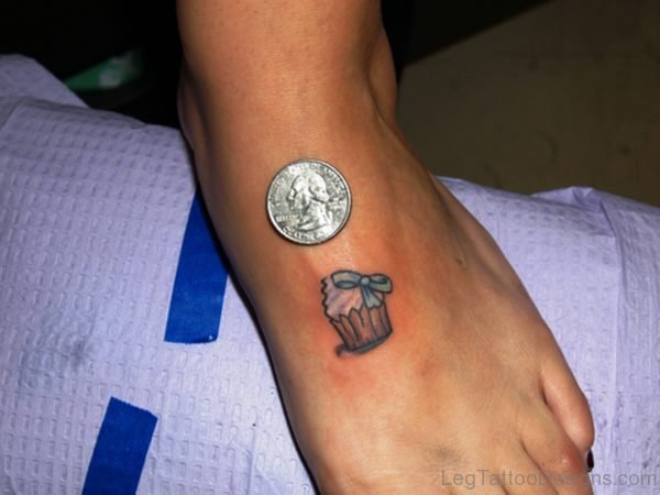 Cupcake With Coin On Foot