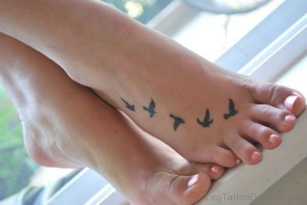 Cute Flying Bird Tattoo On Foot