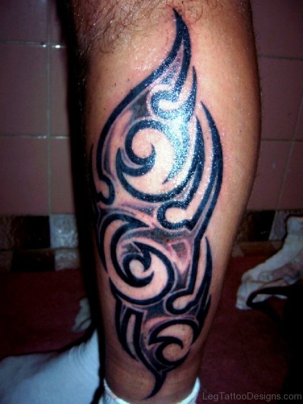 Dark Black Tattoo On Calf