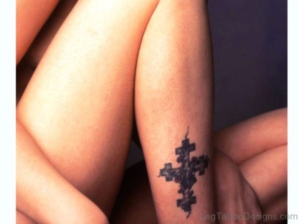 Dazzling Cross Tattoo On Leg