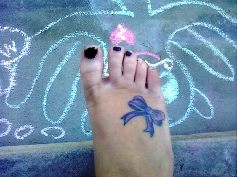 Delightful Bow Tattoo On Foot