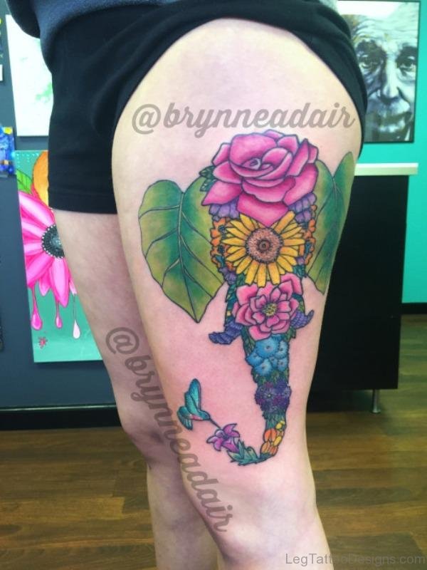 Elephant With Flower Tattoo On Thigh