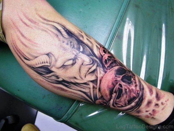 Evil And Skull Tattoo On Leg