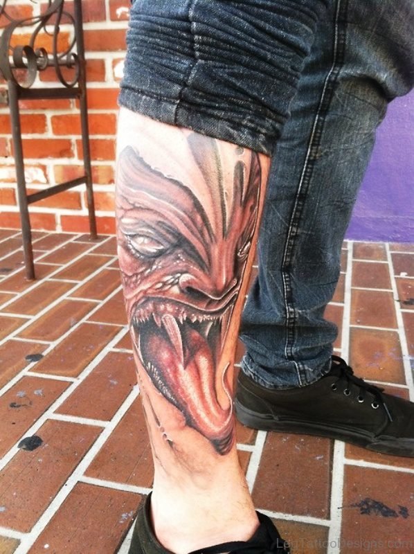 Evil With Tongue Out Tattoo On Leg