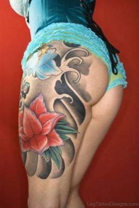 Fish And Flower Tattoo On Thigh