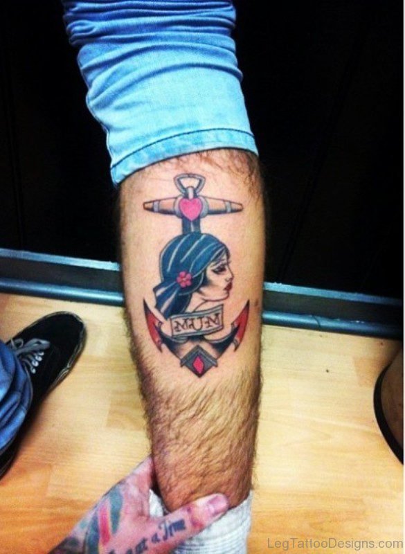 Girl And Anchor Tattoo On Leg