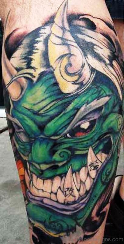 Green Laughing Evil Face Tattoo