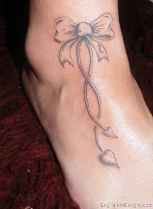 Grey Bow Ankle Tattoo On Foot
