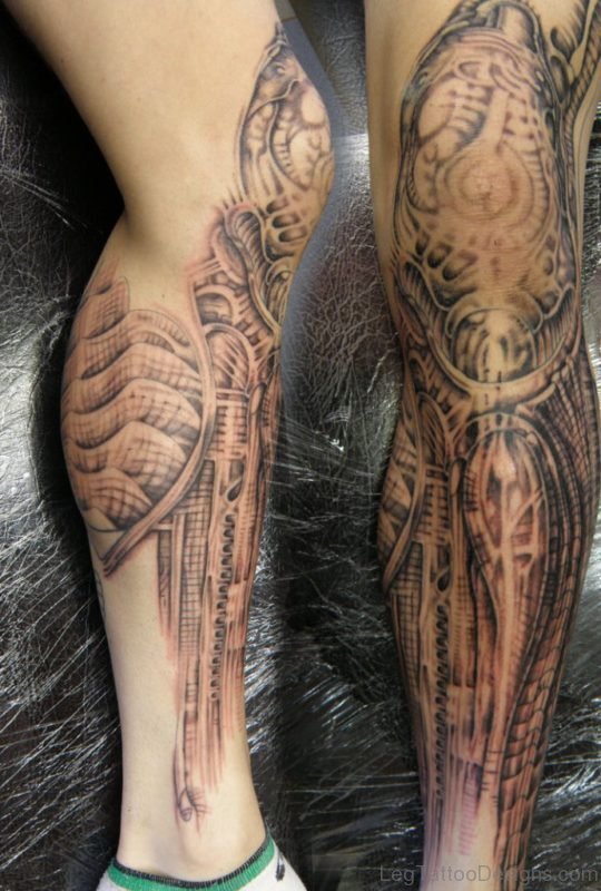 Grey Ink Alien Biomechanical Tattoo On Leg