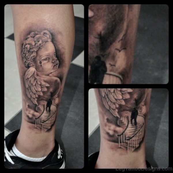 Grey Ink Cherub Angel Tattoo On Leg