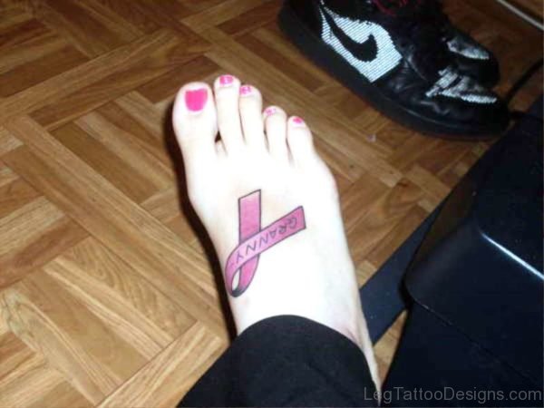 Image Of Cancer Ribbon Tattoo On Foot