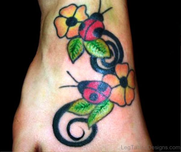 Ladybugs With Colorful Flowers Tattoo