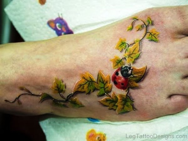 Leaves With Ladybug Tattoo On Foot