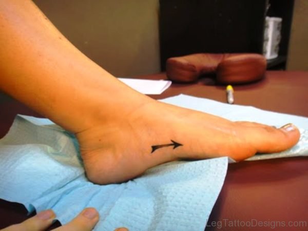 Little Black Arrow Tattoo On Foot
